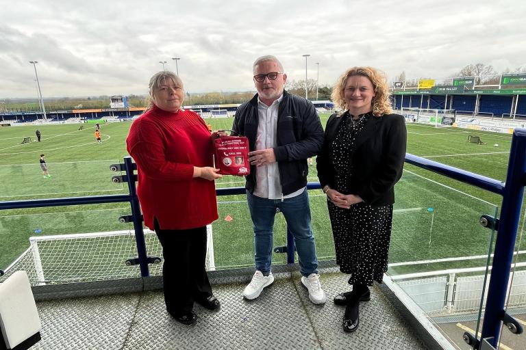 Julie Taylor and Councillor McKinlay hand over a bleed kit to Billericay Town FC's Managing Director, Alex Morrissey.
