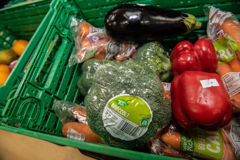 A selection of fresh vegetables - broccoli, peppers, carrots and aubergine