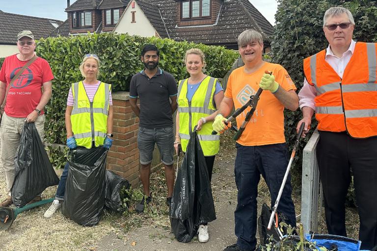 Cllr Louise McKinlay, Deputy Leader of Essex County Council and Cabinet Member for Levelling Up and the Economy, joining other community volunteers cutting back undergrowth in Hutton on Friday 30 June.