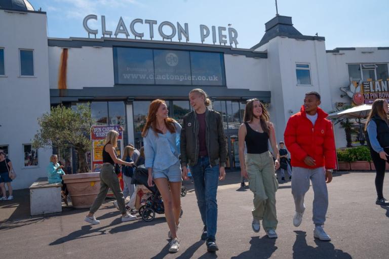 Four young people at Clacton Pier 
