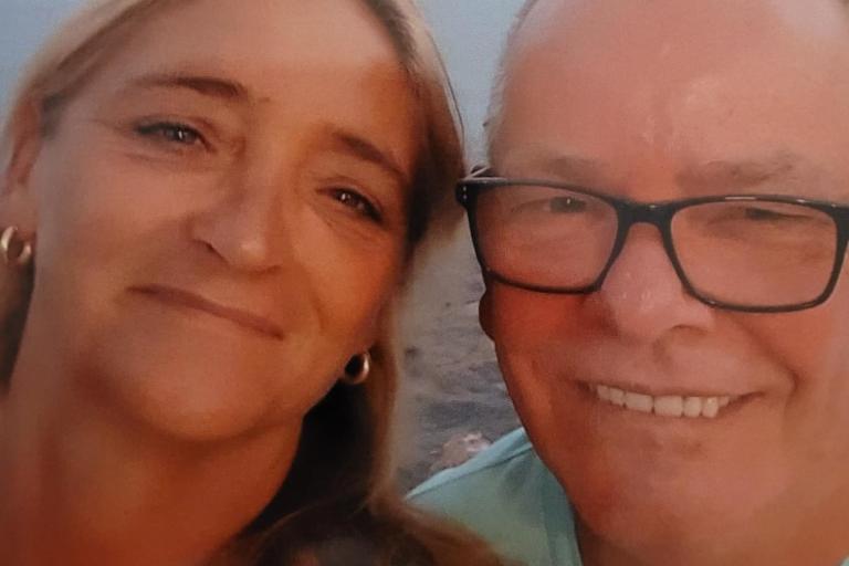 A smiling couple on a beach