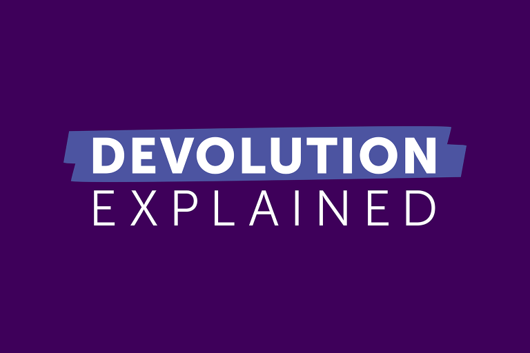 White text on a purple background that says 'devolution explained'