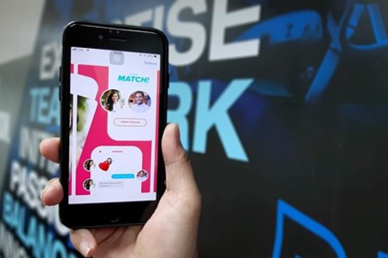 mobile phone showing online dating app match