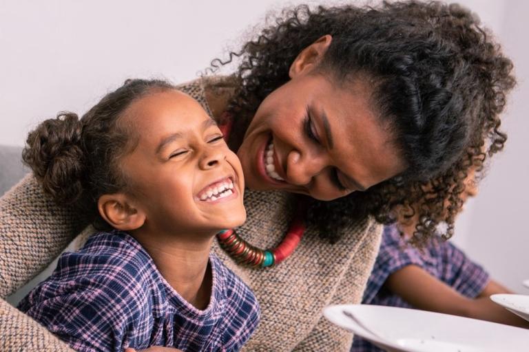 Young girl and women smiling and laughing