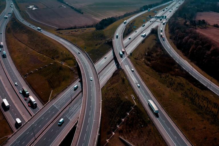 An aerial photograph of a series of roads with traffic on.