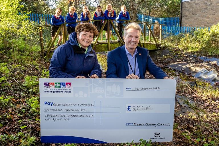 Emma Sweeney, Cllr Peter Schwier and pupils from Great Clacton C of E Junior School photographed in the disused pond area. 