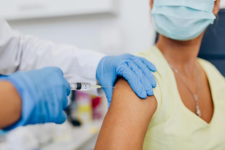 A woman receiving a Covid-19 vaccination 