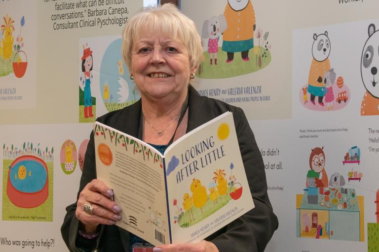 Cllr Beverley Egan, ECC Cabinet Member for Children’s Services and Early Years, with a copy of the Looking After Little picture book. Picture - Mobius Agency