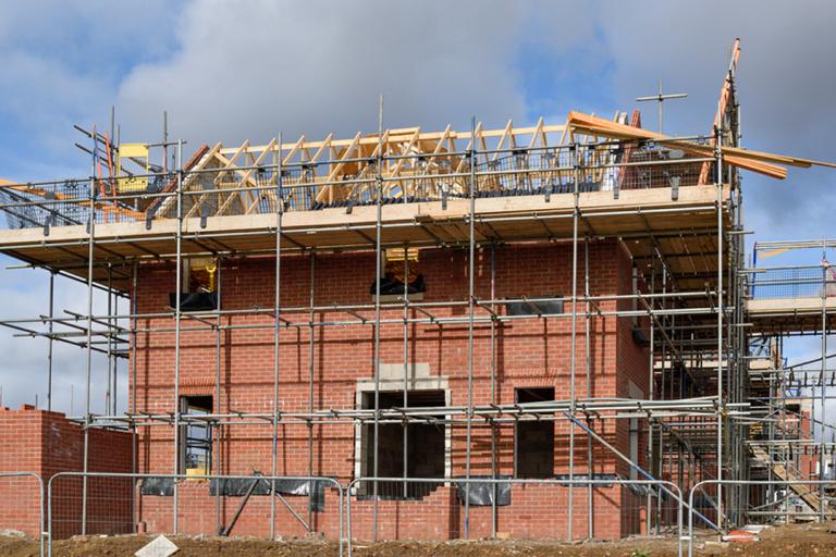 A new house being built with scaffolding around it